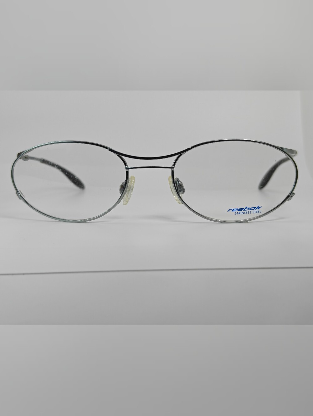 Reebok B1101 Oval Stainless Steel Eyeglass Frames - Silver. Youth.